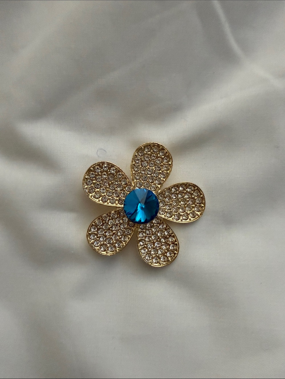 Gold Floral Brooch with Blue Center